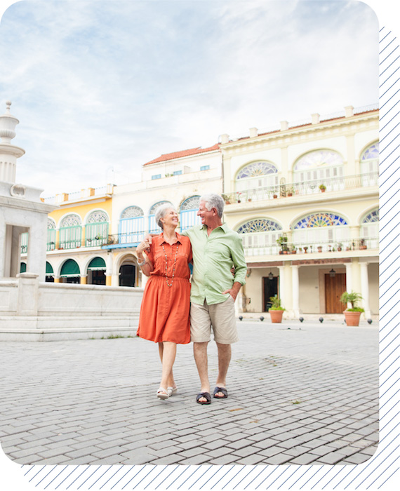 Couple happily looking at each other in a plaza